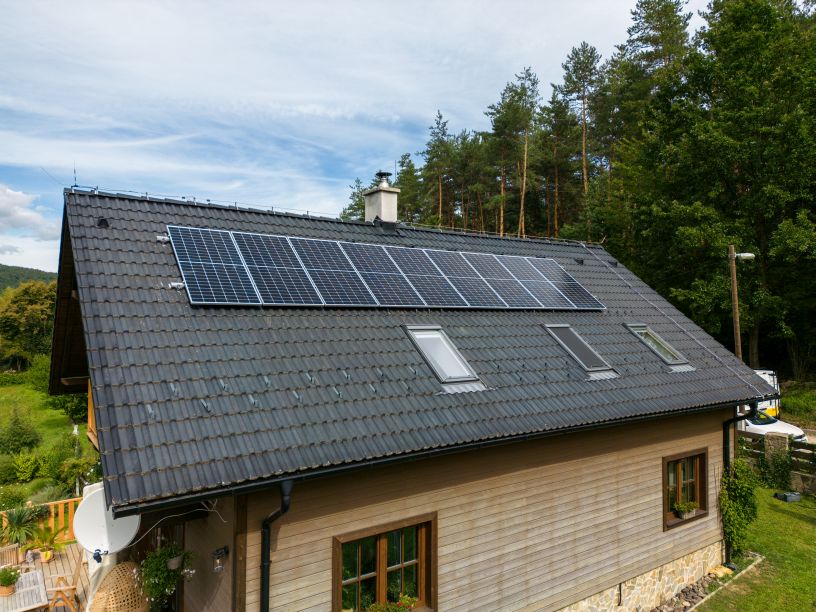 Off-grid solar installation on a house roof by First Solar professionals