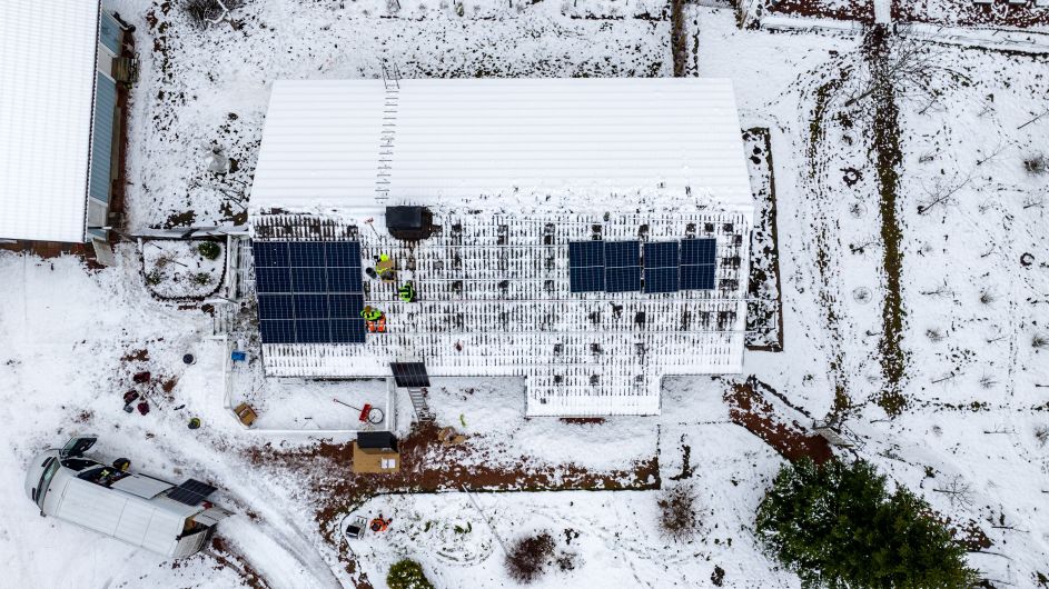 Off-grid solar home with snow on the roof installed by First Solar installers