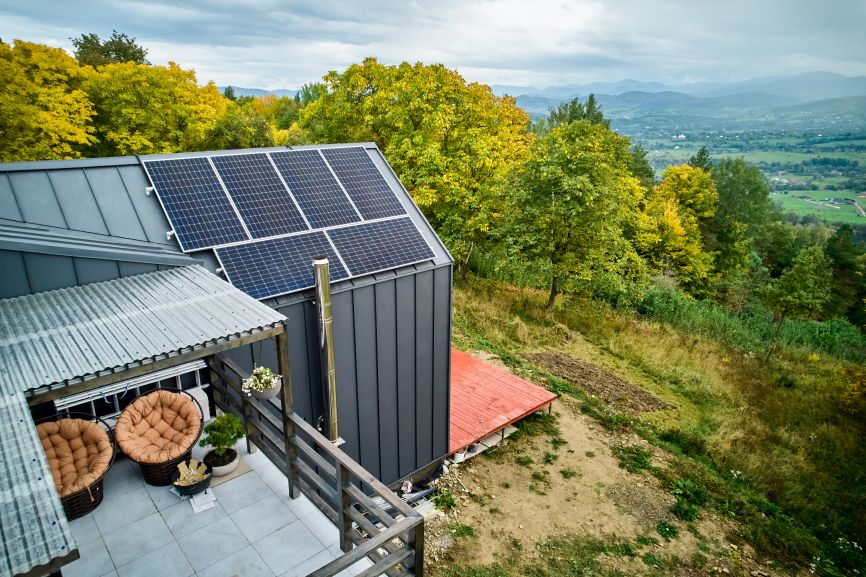 Modern off grid solar home with rooftop panels in a remote location