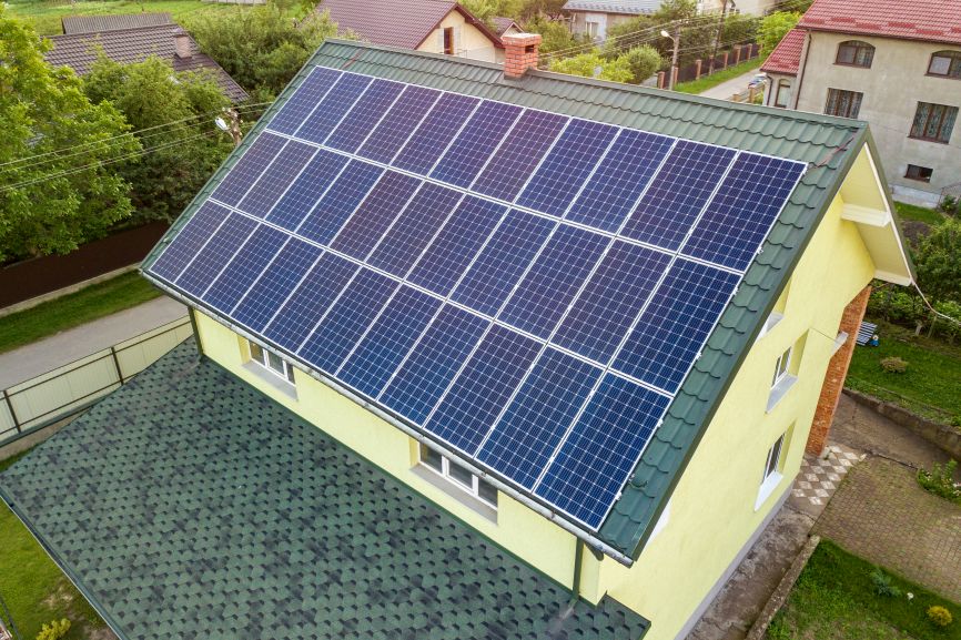 Aerial view of a home featuring a 4000 watt solar panel system installed by First Solar Installers.