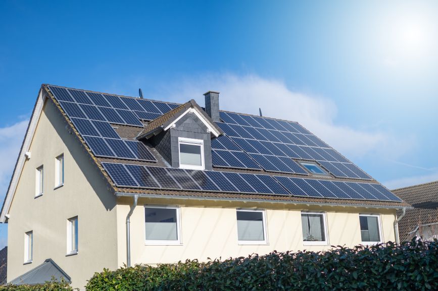 Energy-efficient home with rooftop solar panels installed by First Solar Installers, highlighting Can Solar Panels Power a Whole House?