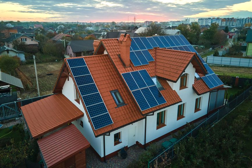 Modern home with full-roof solar panel system installed by First Solar Installers, illustrating Can Solar Panels Power a Whole House?