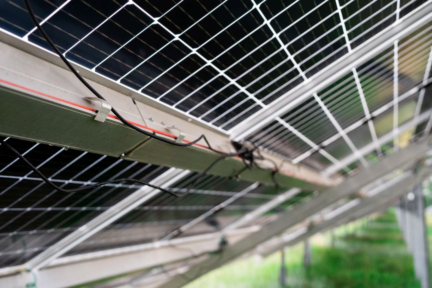 Close-up view of solar panel rails and wiring on roof installation by First Solar Installers showing how to install solar panel rails on roof.
