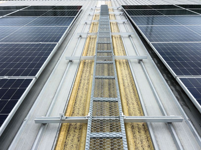 Metal roof installation showing solar panel rails and mounting structure by First Solar Installers demonstrating how to install solar panel rails on roof