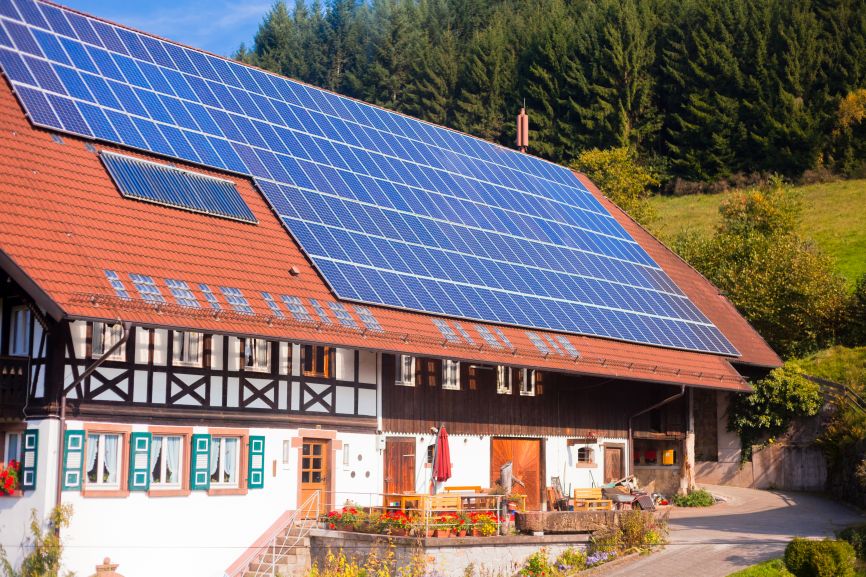 Farmhouse with large rooftop solar panels without battery installed by First Solar Installers