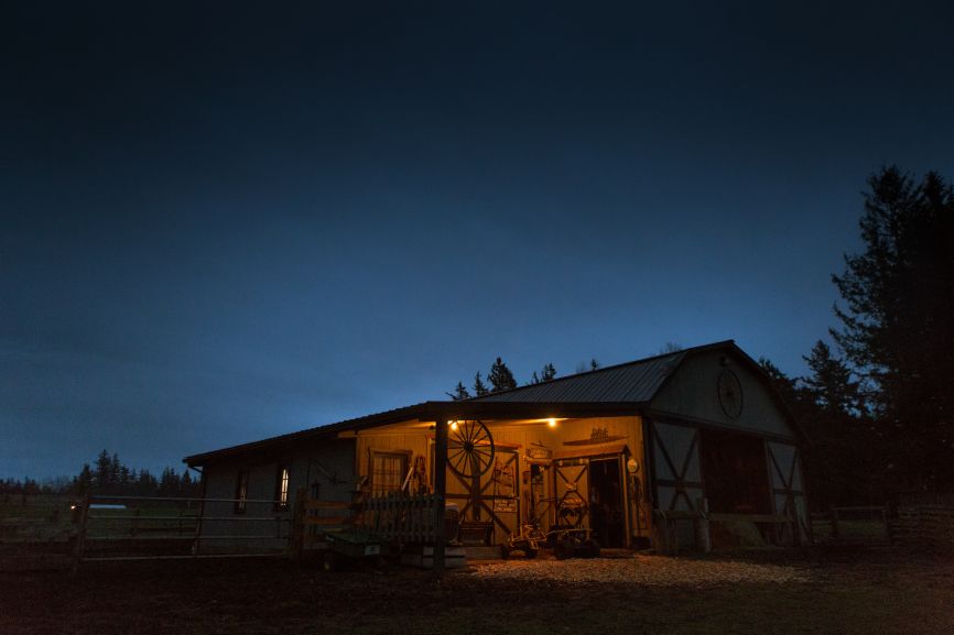 Night time solar home illuminated with warm lights by First Solar Installers