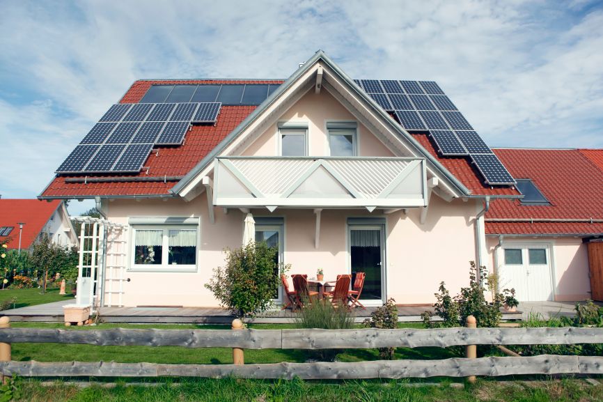 Modern home with rooftop solar panels without battery installed by First Solar Installers