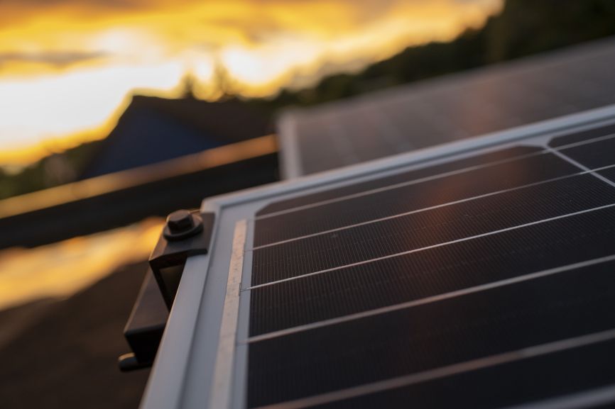 Close-up of solar panels at sunset by First Solar Installers